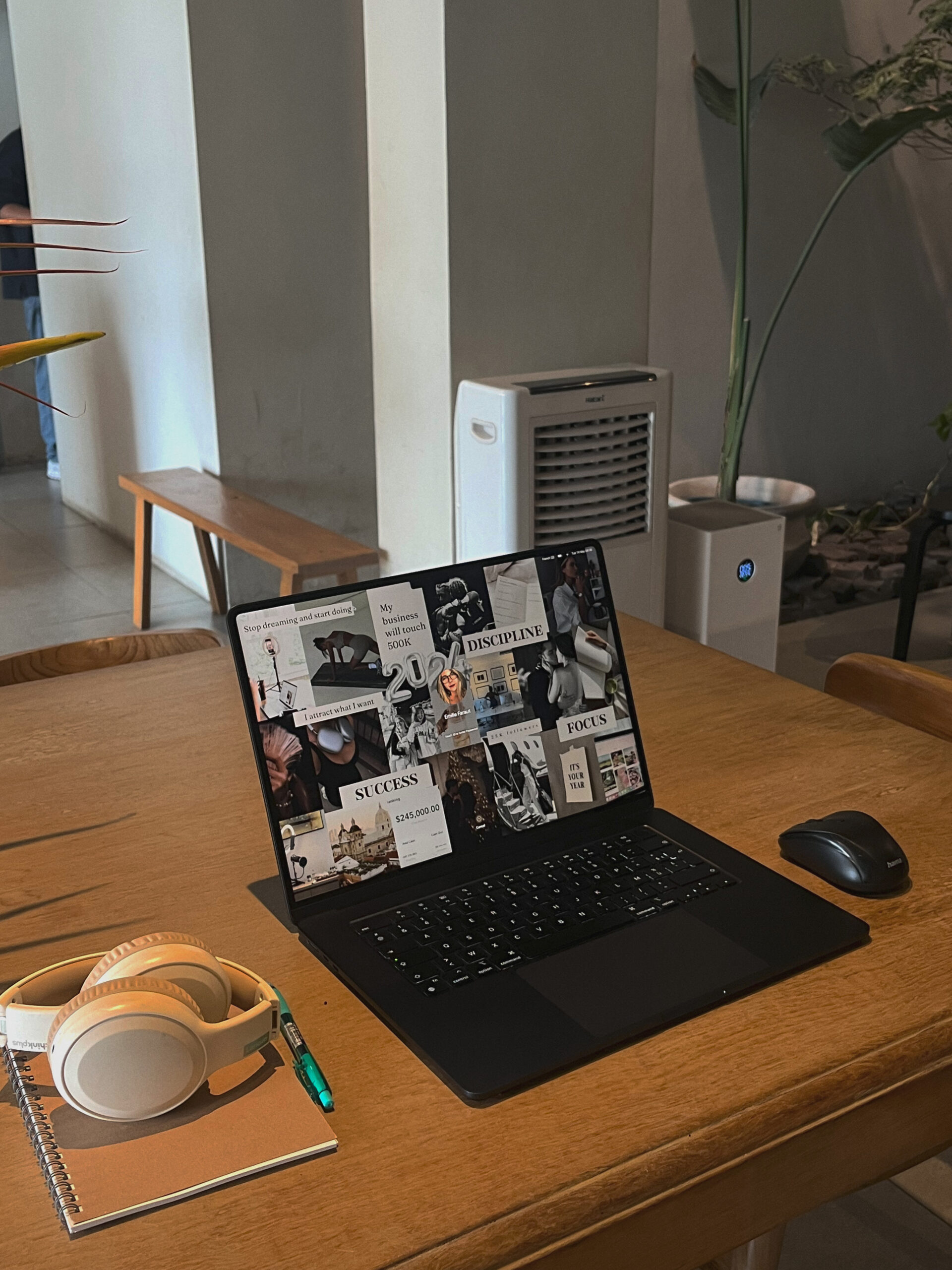 Laptop on a wood desk with shadowed lighting as business owner prepares to write a guest blog post and improve their SEO.