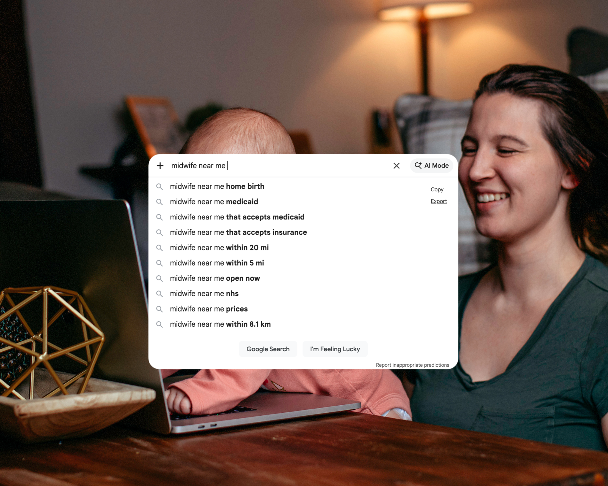 Mckayla, organic SEO consultant for midwives, sitting on floor with daughter in lap working on computer with screenshot of searching "midwives near me" on google