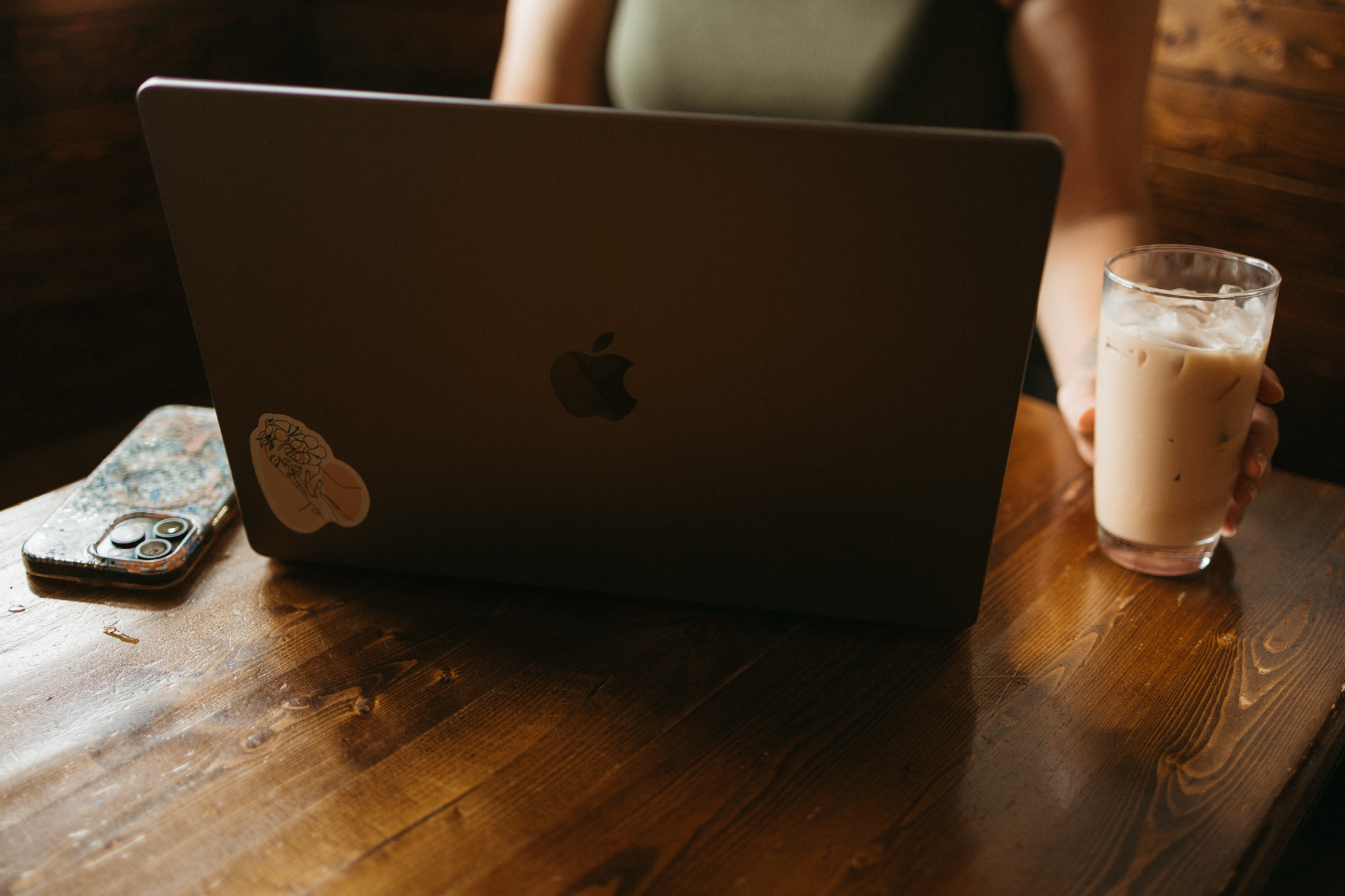 service provider and small business owner on laptop planning blog posts and youtube videos
