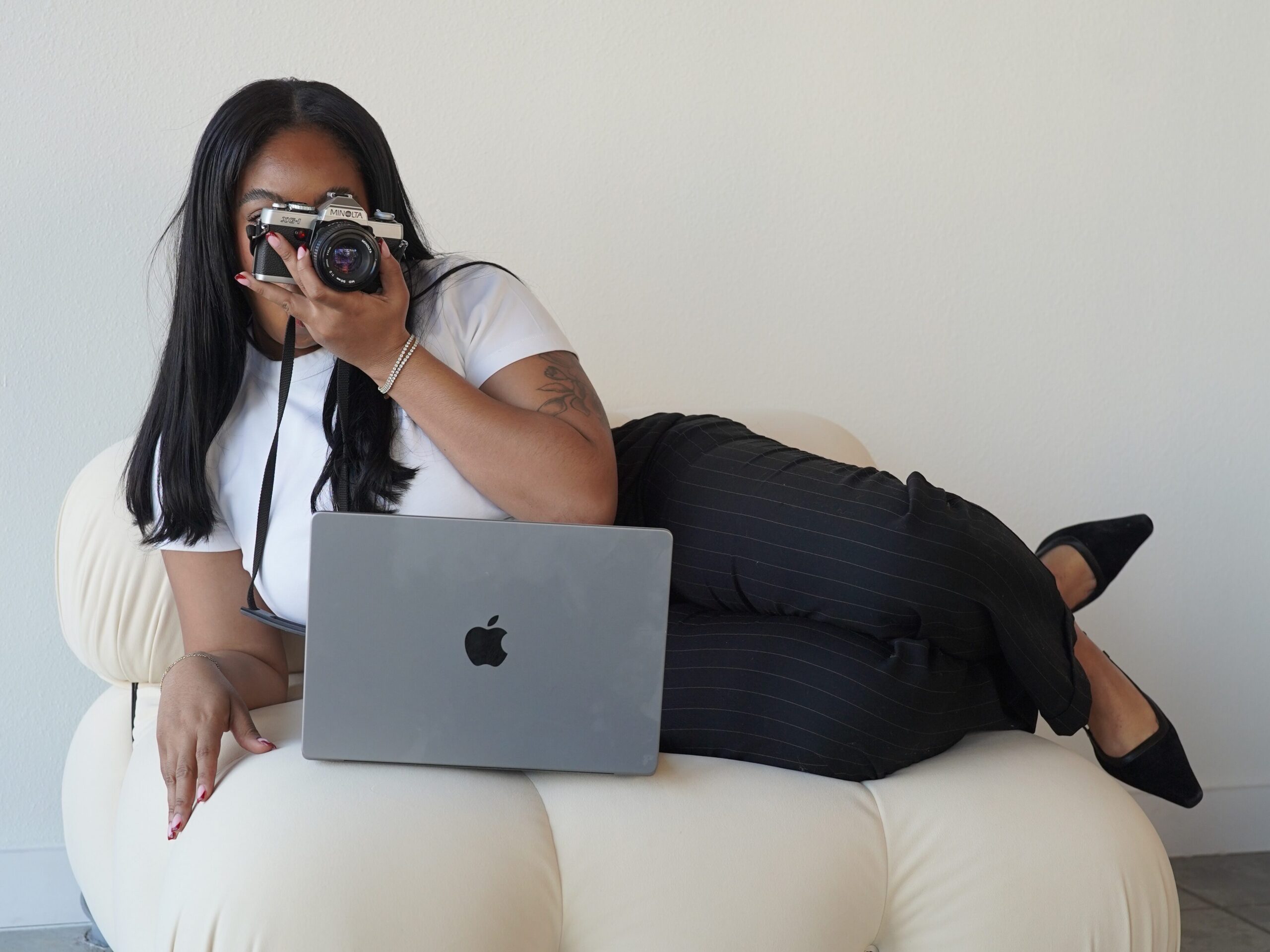 photographer working on computer to market their business locally